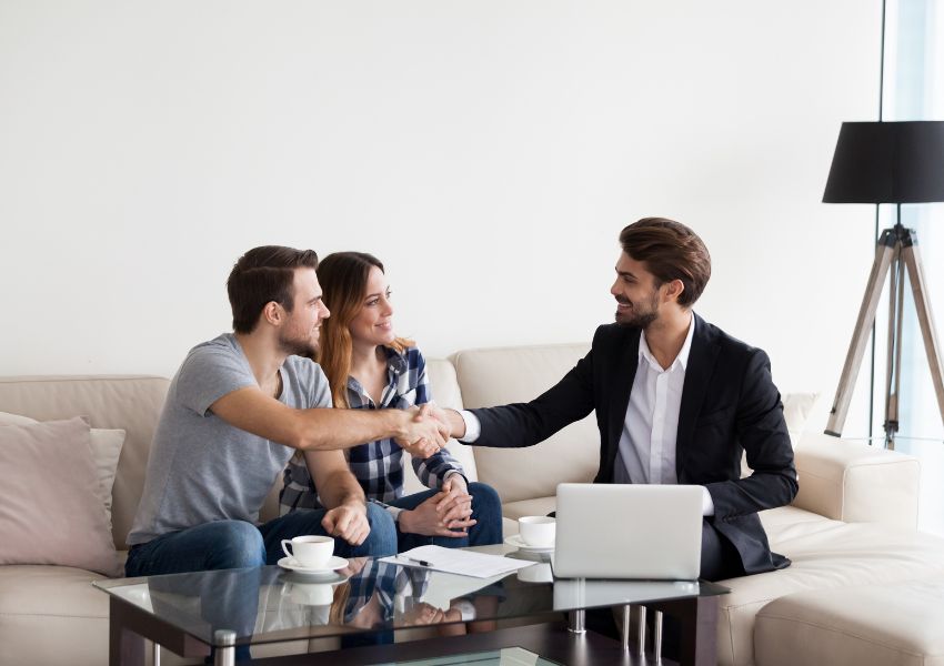 people-shaking-hands-while-sitting-down