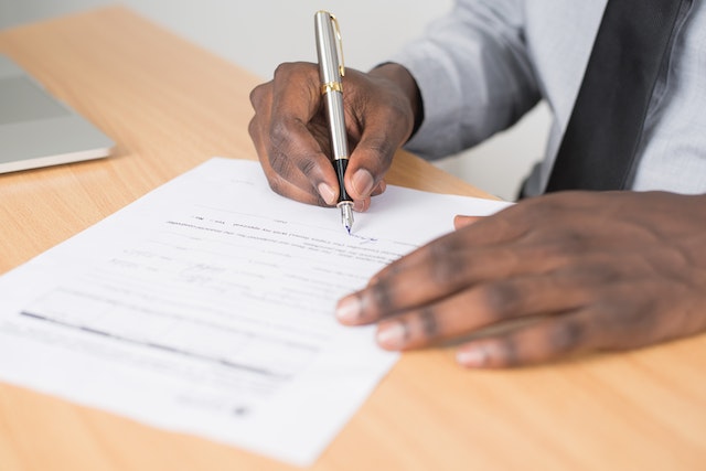 someone signing a contract