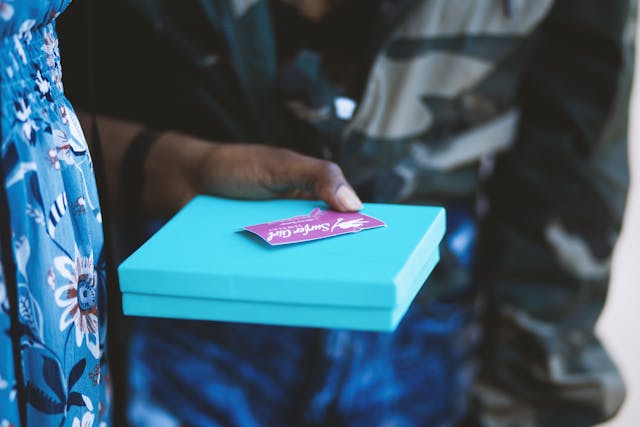 Someone holding a gift box